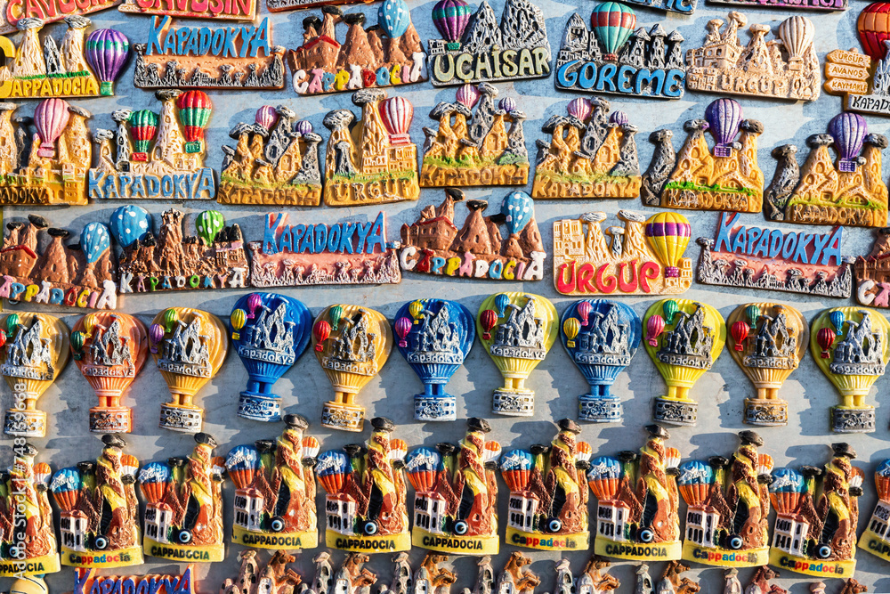Fototapeta premium Magnets at souvenir shop display. Memory gift from unique place. Travelling, souvenirs, shopping. Uchisar (Nevsehir), Cappadocia, Turkey (Turkiye)