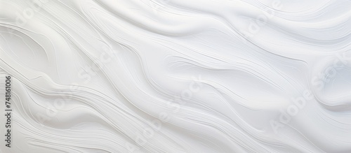 A detailed view of a white wall with wavy lines, showcasing a modern and abstract design created with gypsum texture and plaster. This beautiful artwork adds a unique element to any interior space.