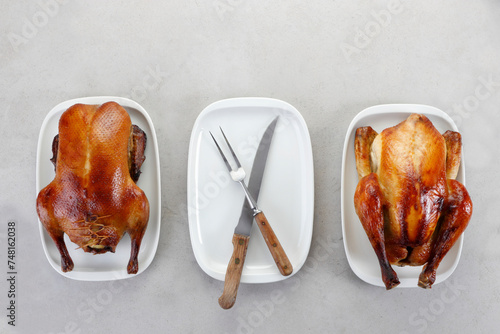 Roasted duck and chicken on white plate photo