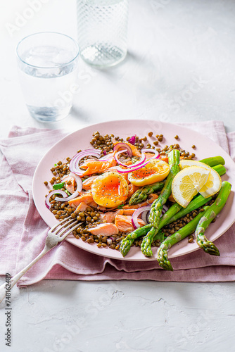 Summer lentil and salmon salad with asparagus and soft boiled egg photo