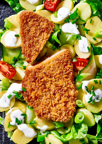 Vegetarian 'schnitzel' on potato salad