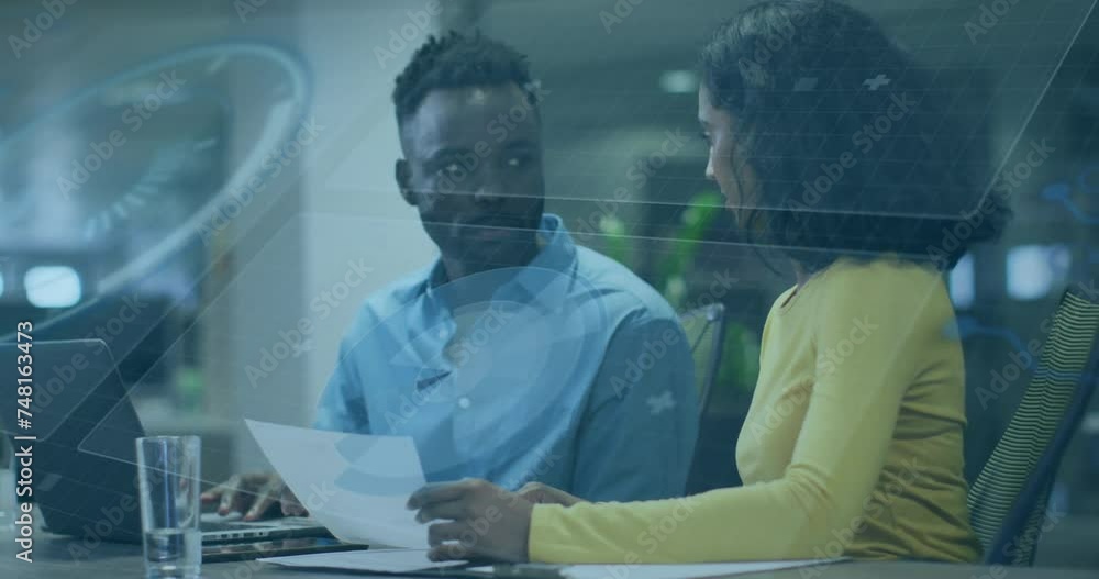 Animation of data processing and diagrams over diverse business people discussing work Animation of data processing and diagrams over diverse business people discussing work