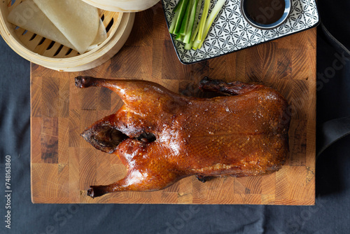 Peking duck with pancakes, cucumber, spring onions and hoisin sauce photo