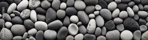 Black and white pebbles background. Abstract background of stones. Travel and vacation concept with copy space. Spa Concept.
