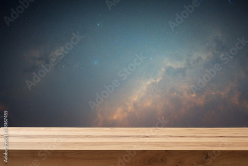 Empty wooden table for product display with a sky night background