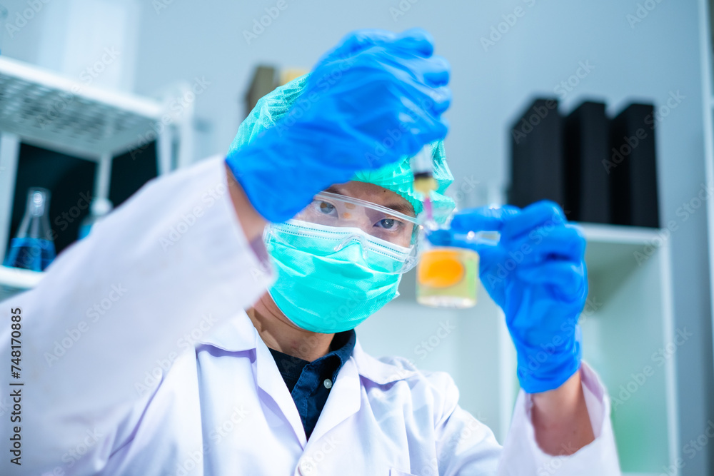 Scientist or nutritionist is using syringe to put liquid in an egg to do experiment or research in laboratory, concept of biochemistry, biotechnology, livestock factory or farm quality control protein Scientist or nutritionist is using syringe to put liquid in an egg to do experiment or research in laboratory, concept of biochemistry, biotechnology, livestock factory or farm quality control protein