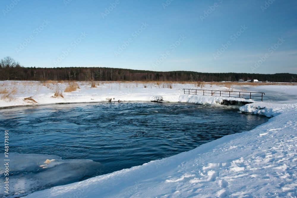 Winter landscape on a frosty day on the river