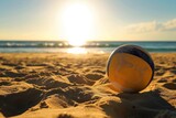 Volleyball ball on the beach with the sun in the background. Vacation Concept. Sport Concept with Copy Space. Beach Volleyball.