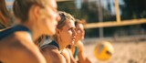 Group of young women playing beach volleyball on the beach. Selective focus. Vacation Concept. Sport Concept with Copy Space.