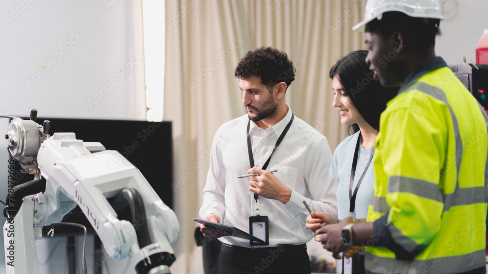 Professional smart robotic engineering team are working and discussing with robotic process or checking, concept of examining manufacturing innovation or invention, technician of futuristic automated. Professional smart robotic engineering team are working and discussing with robotic process or checking, concept of examining manufacturing innovation or invention, technician of futuristic automated.