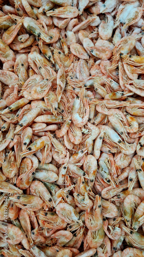 Frozen boiled shrimp in a supermarket or grocery store, close-up. Seafood Frozen boiled shrimp in a supermarket or grocery store, close-up. Seafood