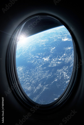 View of planet Earth from a space station porthole. Elements of this image furnished by NASA.