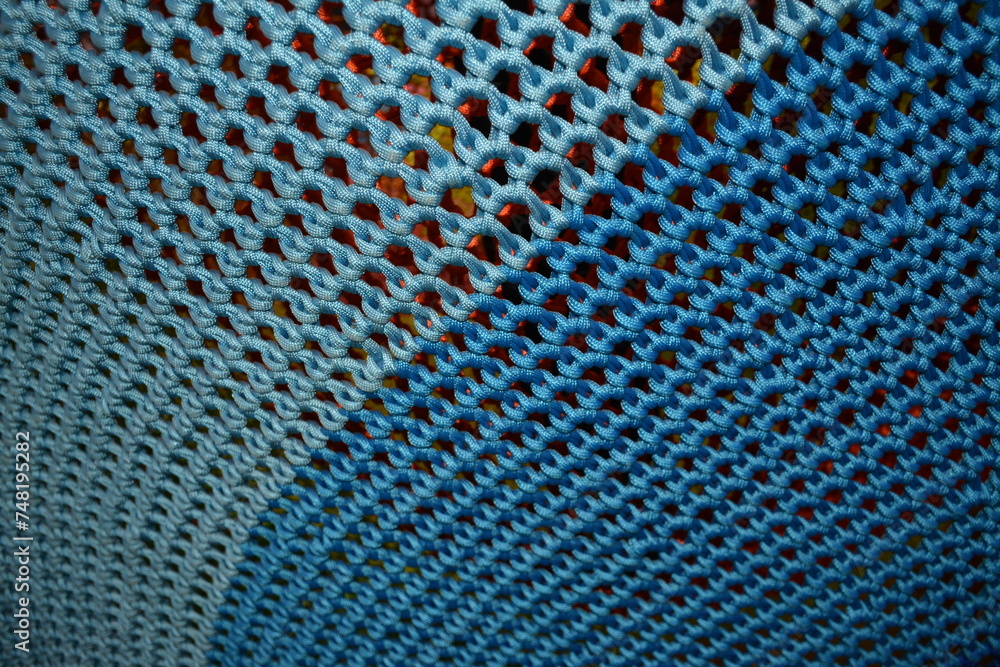 Blue coarse knit mesh closeup Blue coarse knit mesh closeup