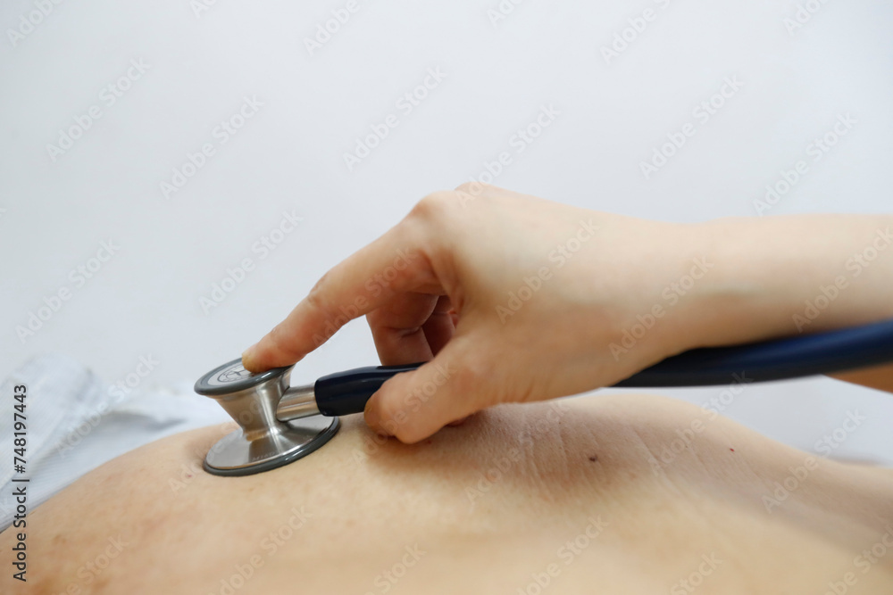 Medical consultation. Auscultation. Detail on stethoscope. Medical consultation. Auscultation. Detail on stethoscope.