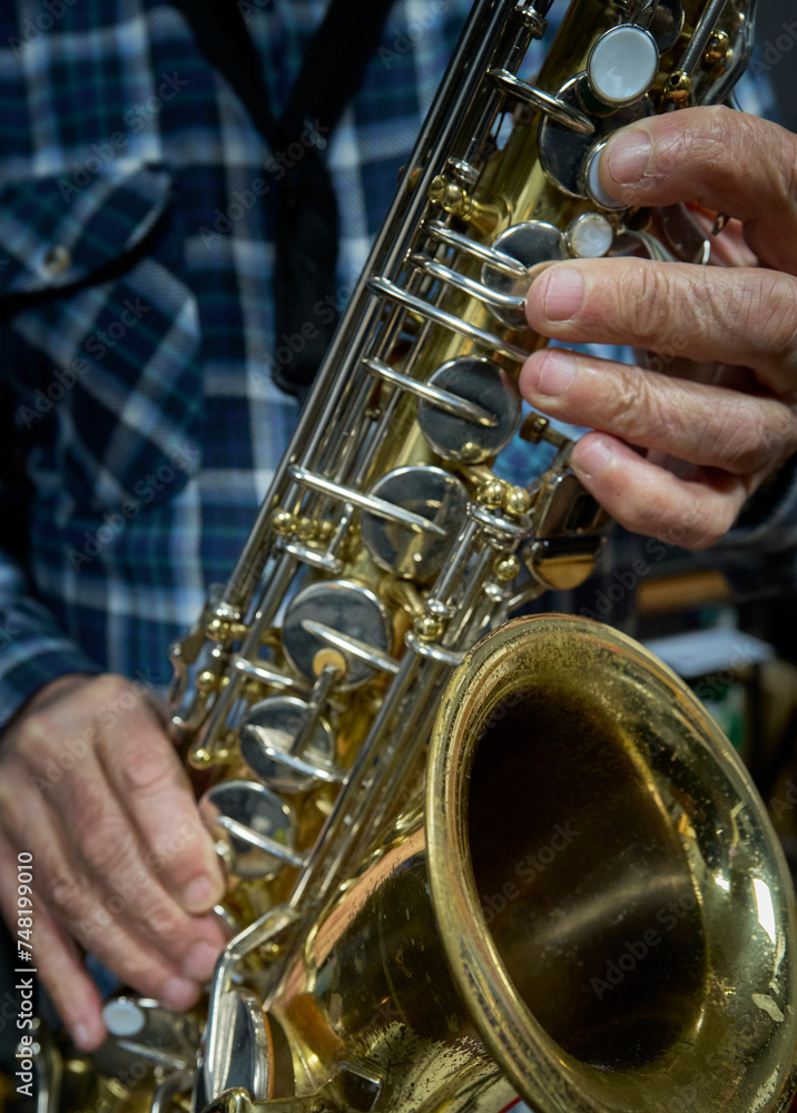 Fototapeta premium Hands and Saxophone in Focus