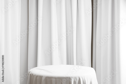 Cylinder podium covered with white cloth on white background. Premium empty fabric pedestal  3d rrender