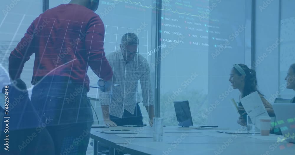 Animation of financial data processing over diverse business people using laptop Animation of financial data processing over diverse business people using laptop