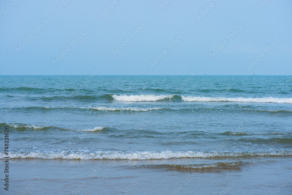 Waves on the beach. Blue sea wave. Blue water surface texture with ripples, splashes, and bubbles. Abstract summer banner background Water waves in sunlight with copy space cosmetic moisturizer. Waves on the beach. Blue sea wave. Blue water surface texture with ripples, splashes, and bubbles. Abstract summer banner background Water waves in sunlight with copy space cosmetic moisturizer.