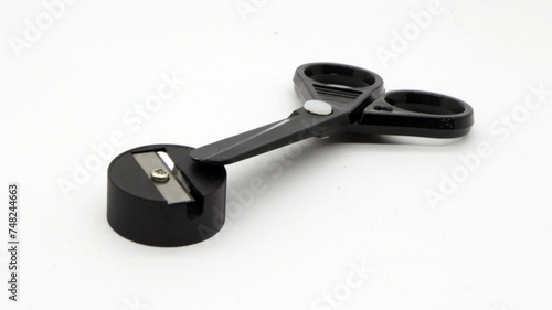 Black scissors with and black pencil sharpener a small size
