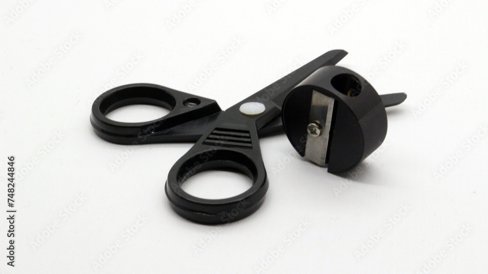 Black scissors with and black pencil sharpener a small size Black scissors with and black pencil sharpener a small size