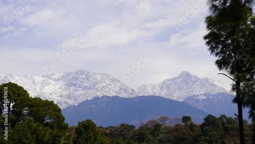 view of attractive snow mountains with tress
