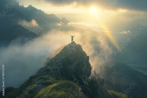 A lone person celebrates atop a mountain peak, basking in the warmth of a breathtaking sunrise