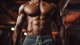 Torso of an African American muscular man in the gym.