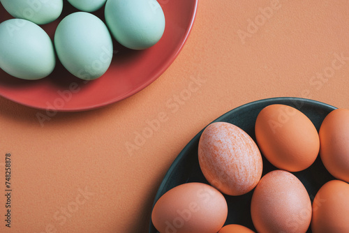 Pastel Easter eggs on colorful plates for holiday celebration photo