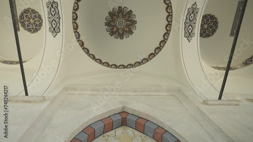 The entrance section of the tomb of Ottoman sultan Yıldırım Bayezid. The camera opens from behind the dome. The column entry appears. photo