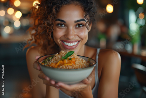 Radiant woman offering a bowl of healthy rice meal. Generative AI image photo