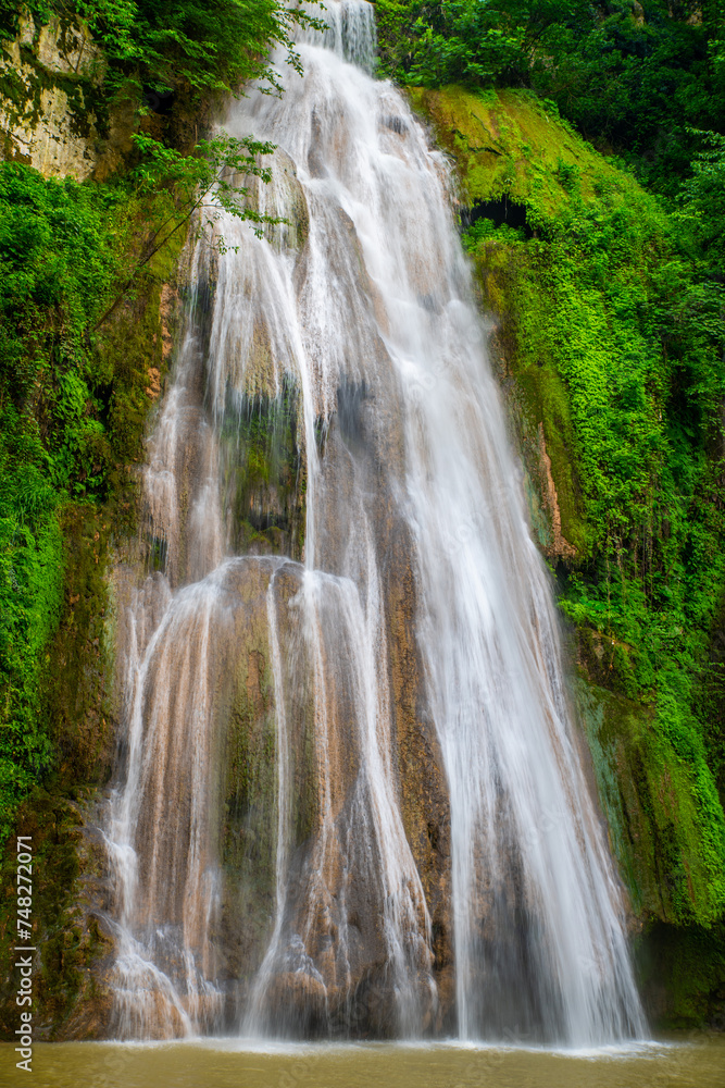 Obraz premium The Dynamic Lowe Waterfall Flowing in Loveh, Golestan Province, Iran