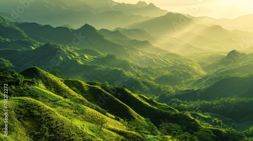 a green hills with sun rays shining through the mountains