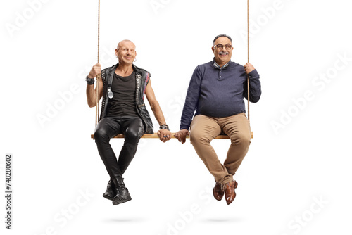 Punk and a mature man sitting on a big wooden swing