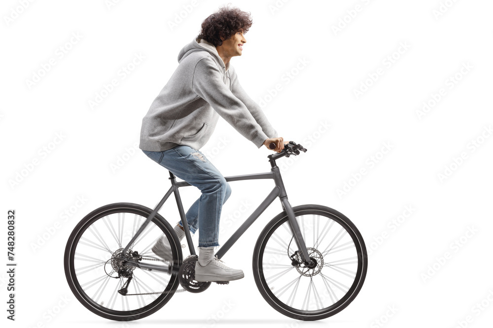Guy wearing jeans and riding a bicycle Guy wearing jeans and riding a bicycle