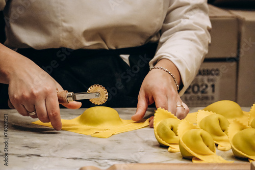 The chef prepares the cappellacci with ricotta and spinach