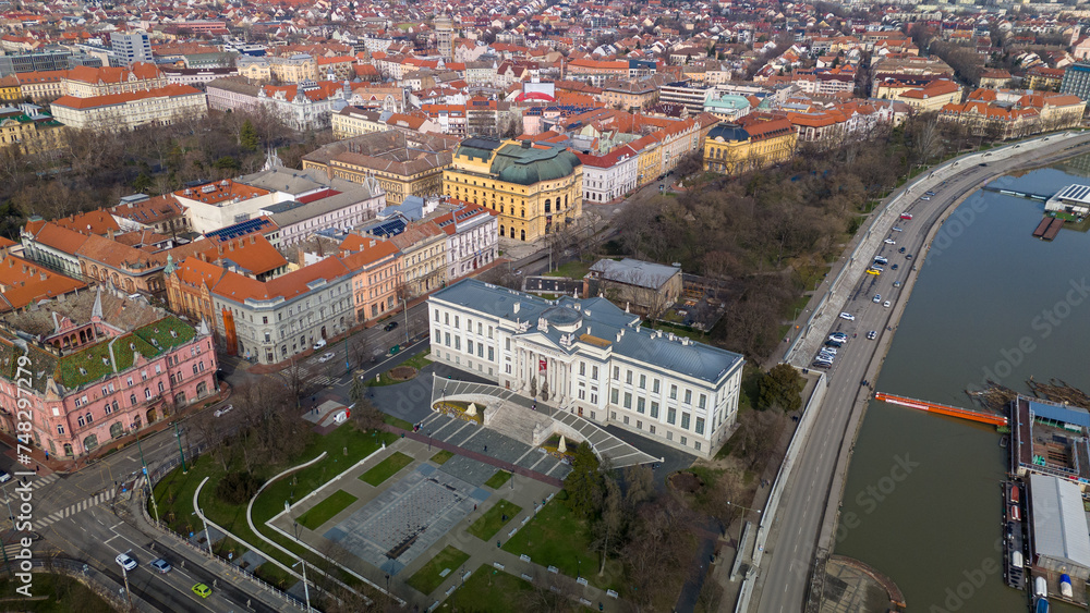 Drone footage from downtown of Szeged, Hungary on a sunny winter day.
Szeged, Drone, Aerial, Hungary, Urban Landscape, Szeged Cathedral, Tisza River, Bridge