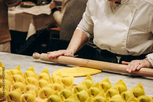 The chef prepares the cappellacci with ricotta and spinach photo