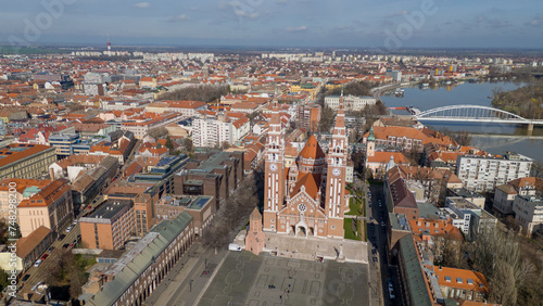 Drone footage from downtown of Szeged, Hungary on a sunny winter day. Szeged, Drone, Aerial, Hungary, Urban Landscape, Szeged Cathedral, Tisza River, Bridge