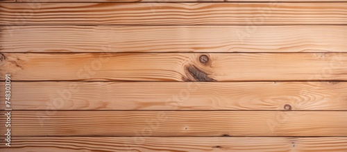 This close-up view showcases the intricate details and texture of a decorative pine wood plank wall, highlighting the natural patterns and grains of the wood.