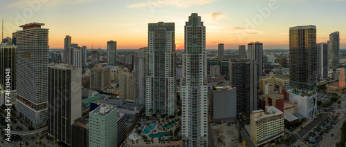 View from above of concrete and glass skyscraper buildings in downtown district of Miami Brickell in Florida, USA at sunset. American megapolis with business financial district at nightfall