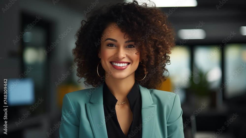 black business woman smiling in office in blue suit