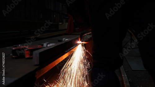 Grinding work with industrial equipment for metal. Clip. Flying sparks of grinding process, concept of heavy industry.
