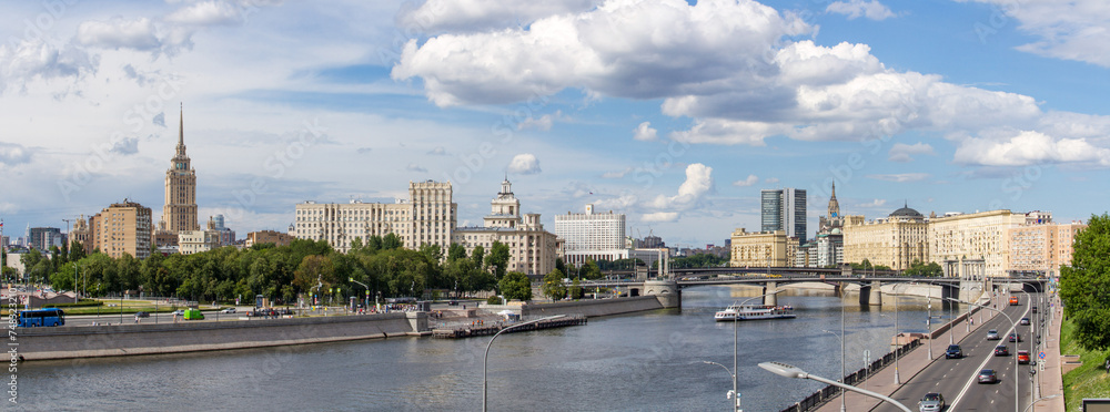 Panoramic view of the Berezhkovskaya embankment in Moscow. Borodinsky Bridge, White House and the pier on the Moskow River.