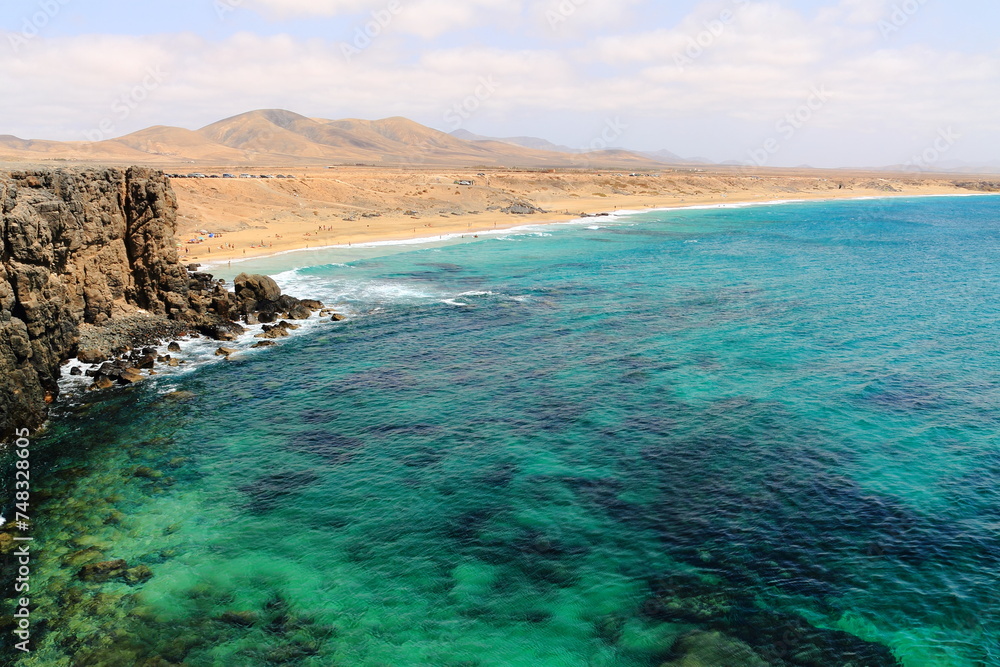 Beach by the deep blue sea