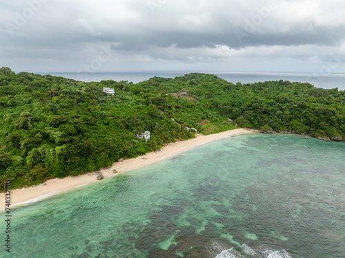 Clear turquoise sea waters and waves in Ilig Iligan Beach. Boracay, Philippines. photo