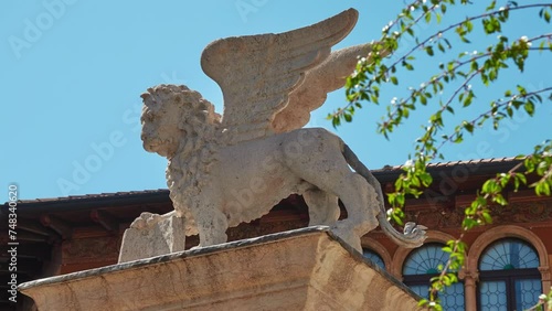 Statue with the Lion of San Marco, symbol of Venetian domination. Piazza Liberta, Bassano del Grappa, Vicenza province of region of Veneto, in northern Italy.