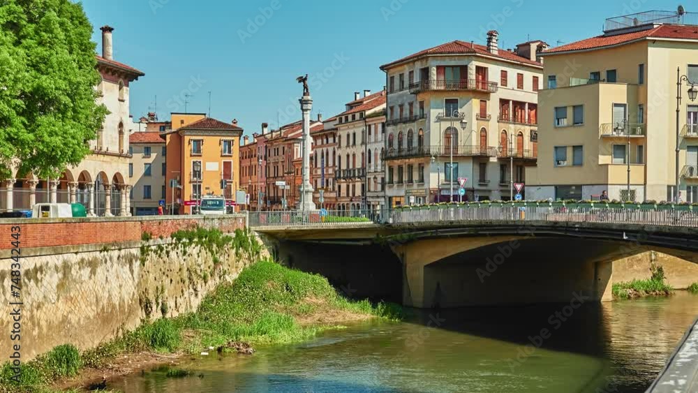 VICENZA, ITALY - APRIL 22 2018: Bridge of Angels and Square XX September with winged angel on Bacchiglione River in historic center of Vicenza, Italy. VICENZA, ITALY - APRIL 22 2018: Bridge of Angels and Square XX September with winged angel on Bacchiglione River in historic center of Vicenza, Italy.