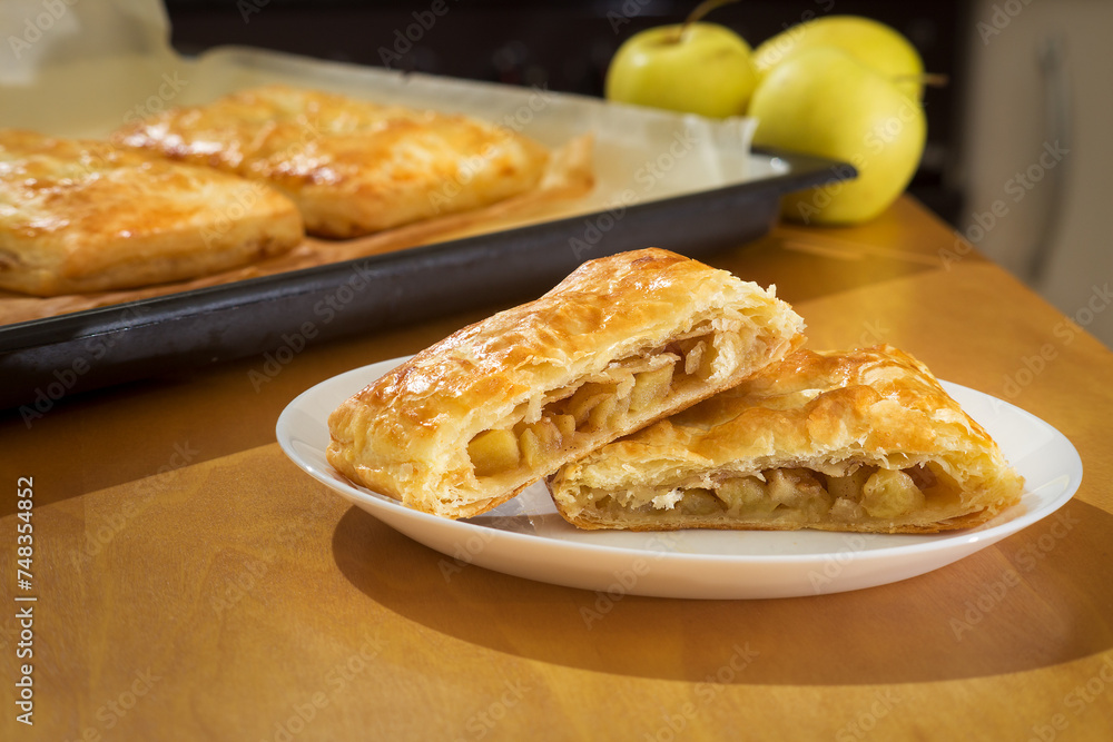 Homemade puff pastry pie filled with apple and cinnamon
