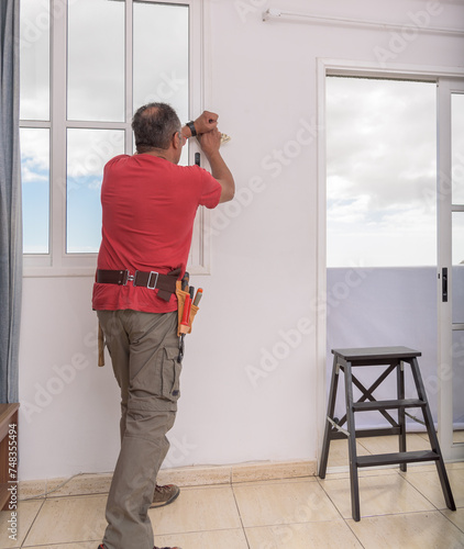worker cleaning a wall photo