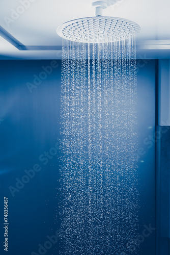 large rain shower head and water drops in the bathroom